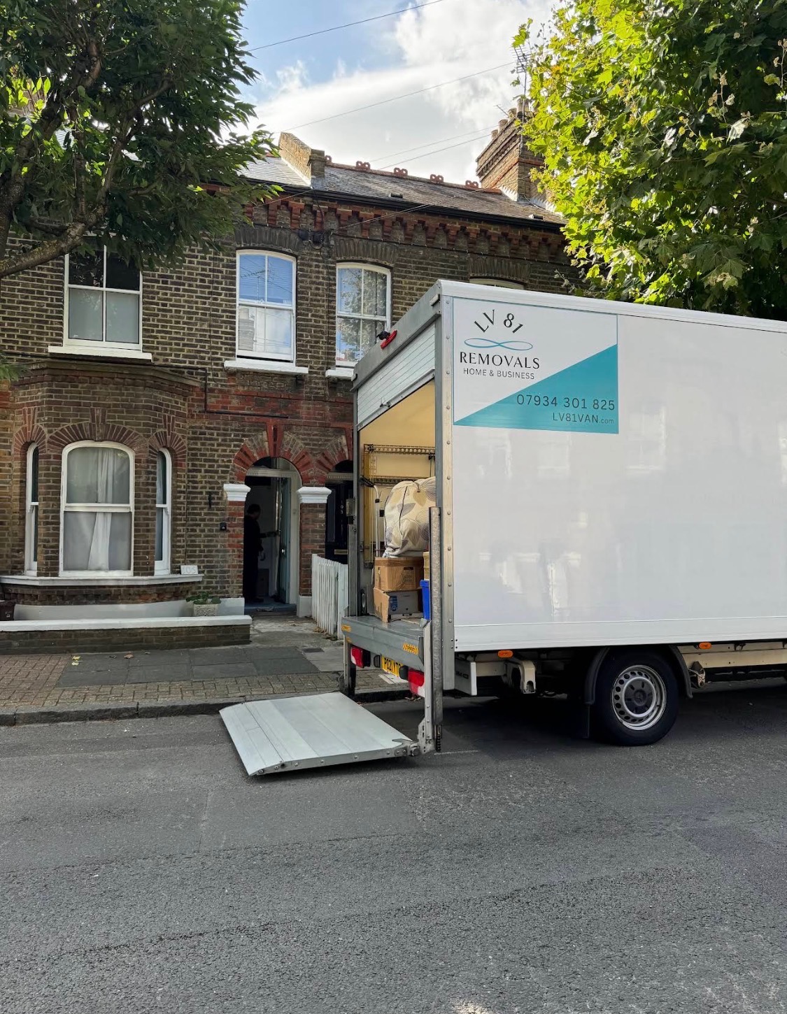 LV81 Removals branded Luton van on a residential move