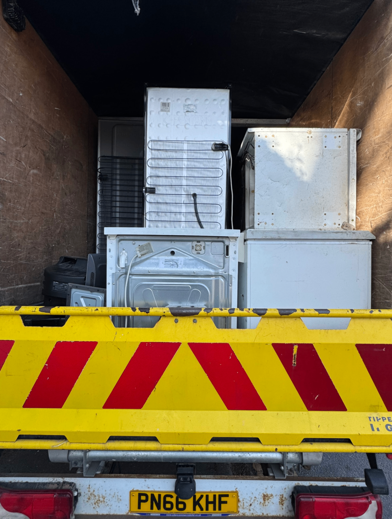 Domestic appliances secured inside the removal van for disposal