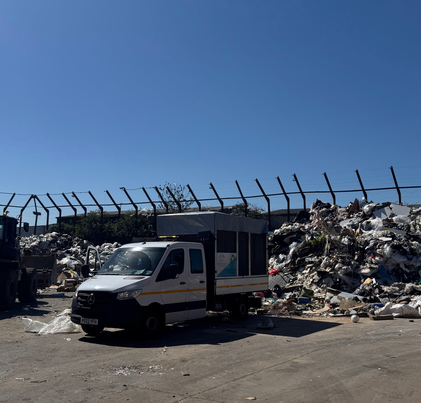 LV81 Removals van unloading waste at a licensed recycling yard